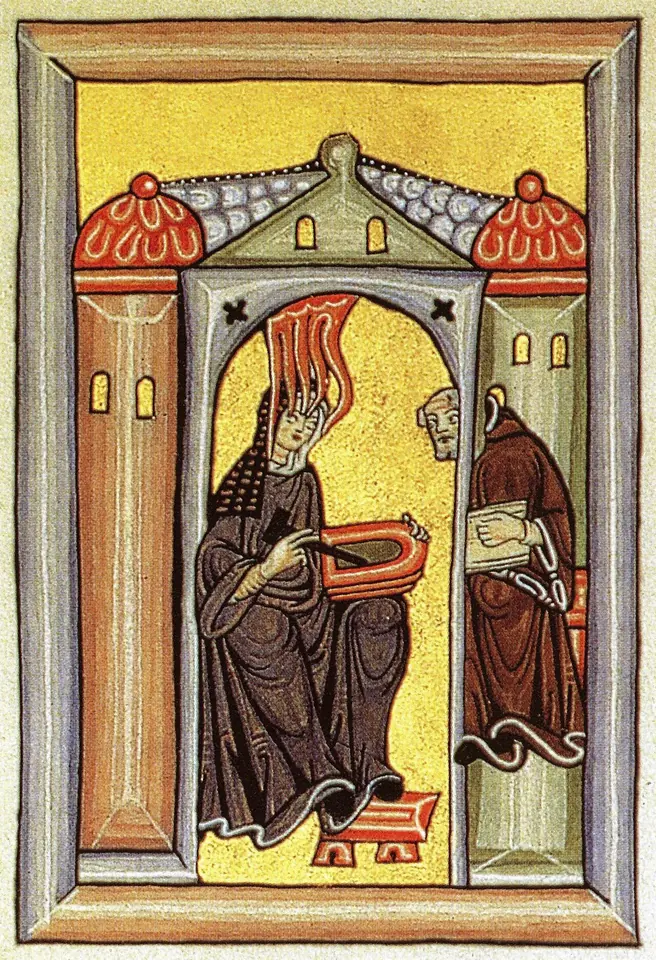 Medieval miniature of a nun seated under a church arch with tongues of fire descending on her head as she writes on a wax tablet, while a monk peers in from a side window