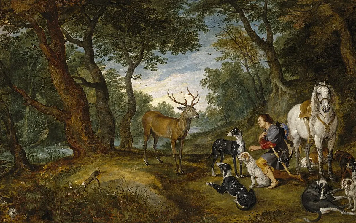 Flemish painting of a deep forest glade where a kneeling huntsman, his white horse and many hounds face a great stag with a crucifix shining between its antlers