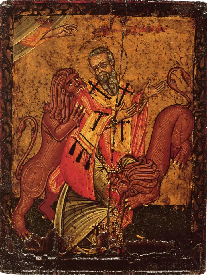Greek icon of a gray-bearded bishop in a white stole with black crosses standing calmly between two red lions on a gold ground
