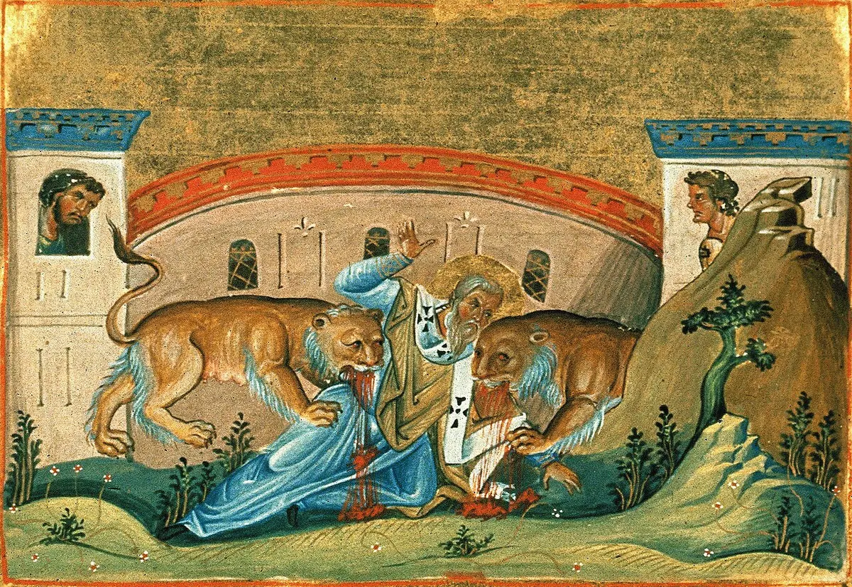 Byzantine manuscript painting of an old bishop in blue robes on the ground of an arena between two lions, with spectators looking down from the walls
