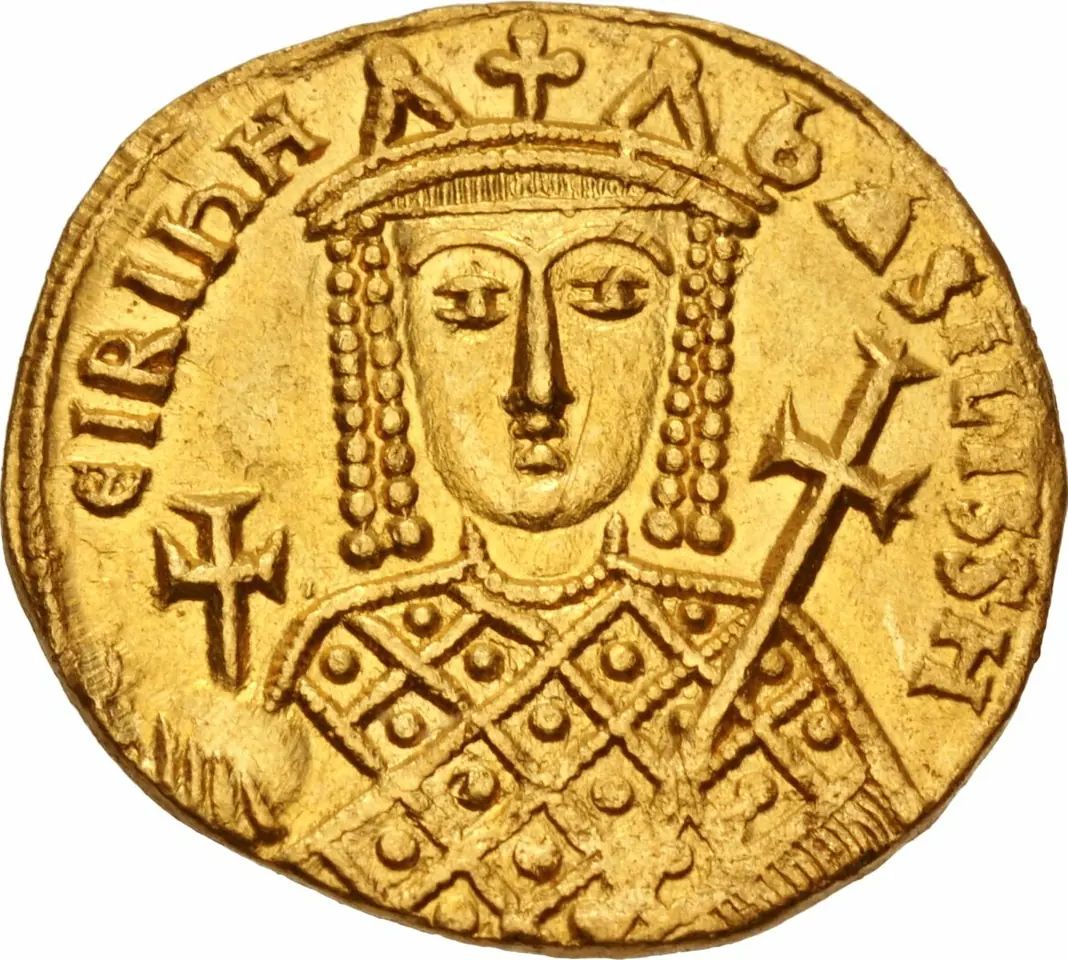 Worn gold coin showing the facing bust of Empress Irene in a crown with hanging pendants, holding an orb with a cross and a cross-topped scepter, with her name in Greek letters around the edge