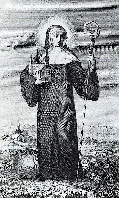 Engraving of a haloed abbess in a black habit and white wimple holding a crosier and a model of a church with a tall spire, standing in a landscape with a village behind her