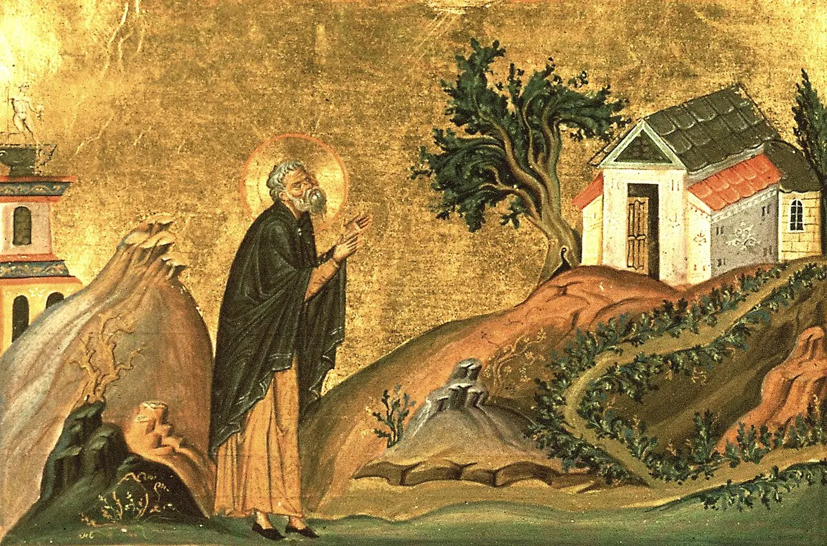 Byzantine miniature on a gold background of an old bearded monk in a dark mantle raising his hands toward heaven on a rocky hillside beside a small red-roofed church and a tree