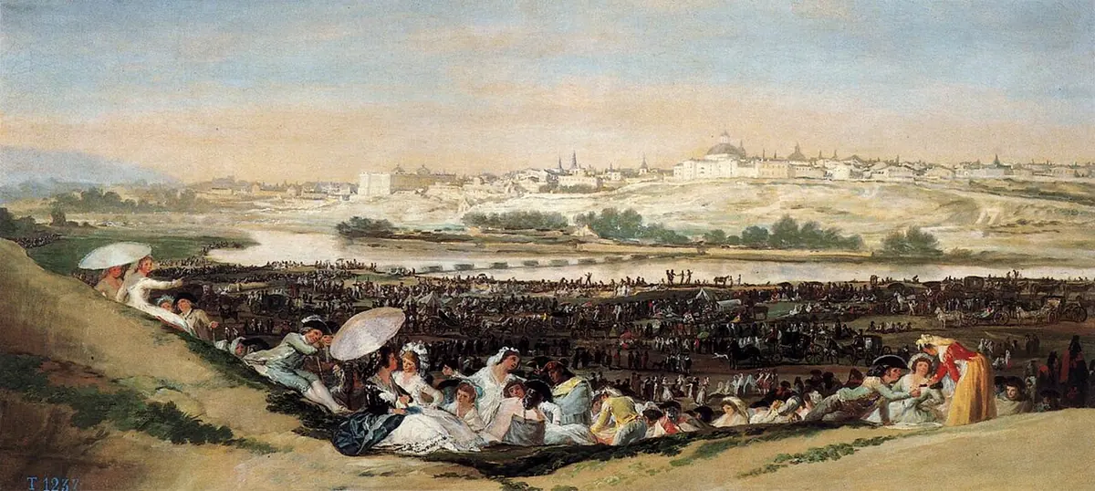 Wide painting of crowds in light summer clothes picnicking on a grassy slope above the Manzanares River, with the city of Madrid on the far bank