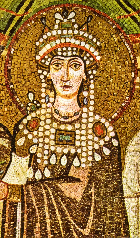 Byzantine mosaic of Empress Theodora with a halo, wearing a tall jeweled crown hung with strings of pearls and a heavy jeweled collar over a purple robe
