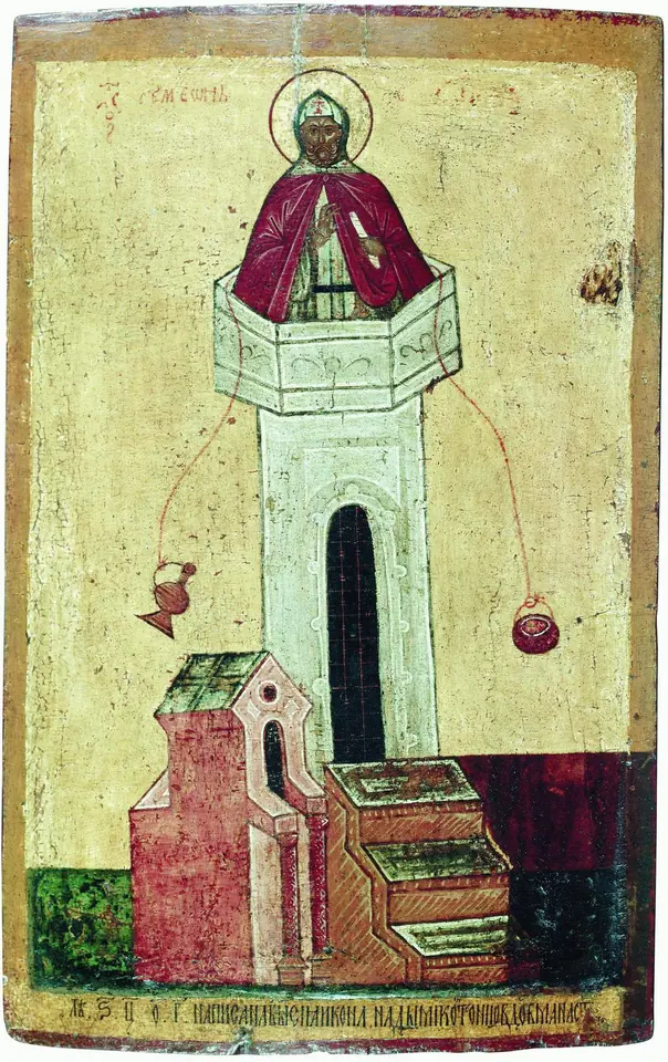 Old icon of a monk in a red cloak standing at the top of a tall pale pillar beside a small church, with a basket hanging on a rope