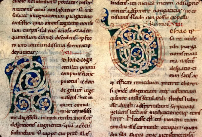 Page of a medieval Latin manuscript in two columns with large decorated initials in red, blue and green interlace