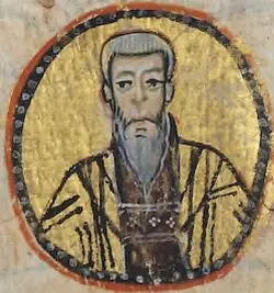 Small round Byzantine manuscript portrait on gold of a gray-bearded monk with a hood, in a dark habit