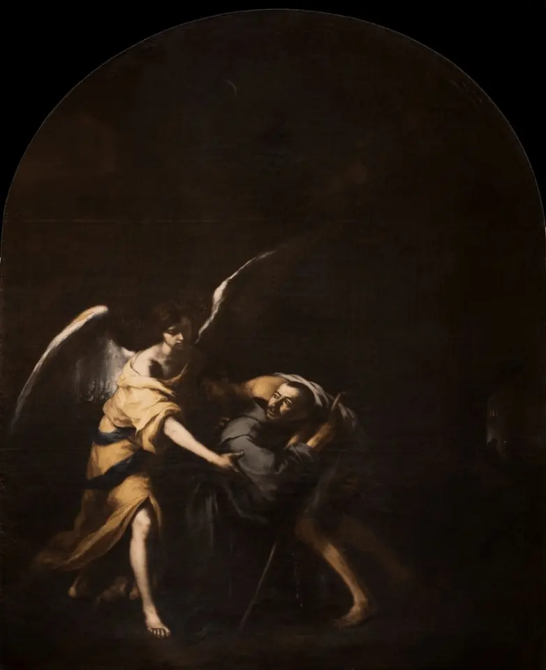 In near darkness, John of God stumbles under the weight of a sick man on his back while a winged angel bends down out of the light to help him carry the load