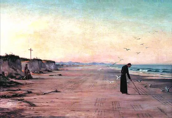 On a wide pink-gray beach at dusk, a small figure in a black cassock bends to write with a staff in the wet sand, seabirds around him and a cross on the cliffs behind