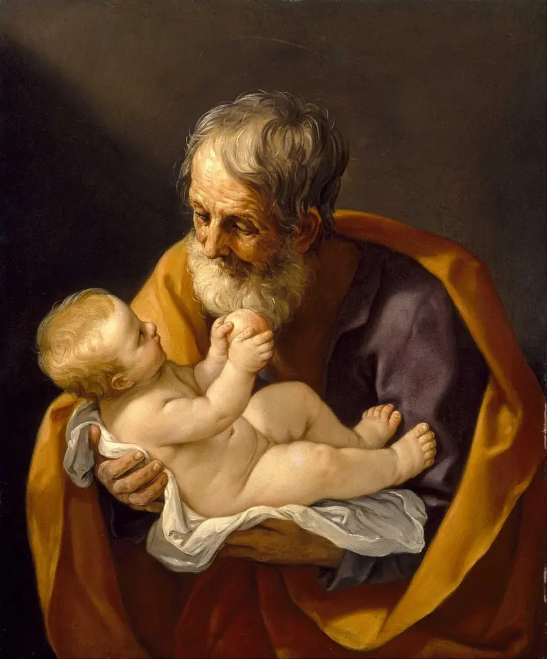 Baroque painting of a white-bearded St. Joseph in a golden cloak cradling the naked Christ Child, who reaches up and touches his face