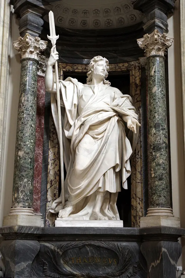 Large white marble statue of St. Jude in a niche framed by green marble columns, holding a tall halberd and a book