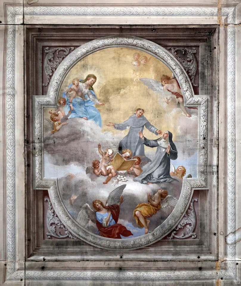 Ceiling painting of a friar in a black habit presenting a kneeling nun to the Virgin and Child in the clouds, surrounded by angels