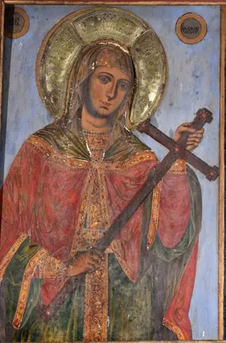 Icon of a woman martyr with a gold halo in a red and green mantle, holding a large wooden cross before her