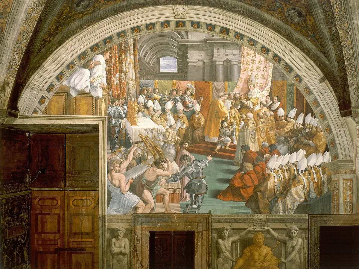 Wall fresco of a crowded basilica where a pope seated on a throne crowns a kneeling emperor, with rows of bishops in white miters on the right
