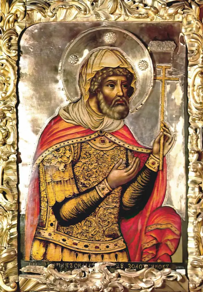 Russian icon of a bearded St. Longinus in gold armor and a red cloak, wearing a turban-like cap and holding a small cross, in a silver frame