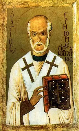 Byzantine icon of a bald, white-bearded bishop in a white omophorion with large black crosses, holding a jeweled red Gospel book against a gold ground