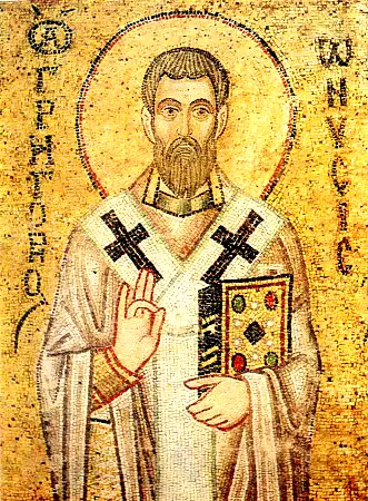 Gold mosaic of a bearded bishop in a white omophorion with large black crosses, blessing with his right hand and holding a jeweled Gospel book