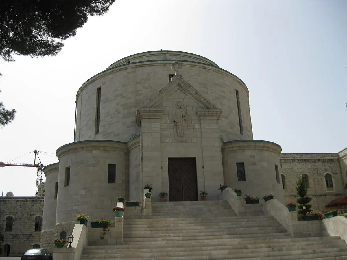 The round domed stone church of the Rosary Sisters in Jerusalem, with a wide flight of steps leading up to its doors
