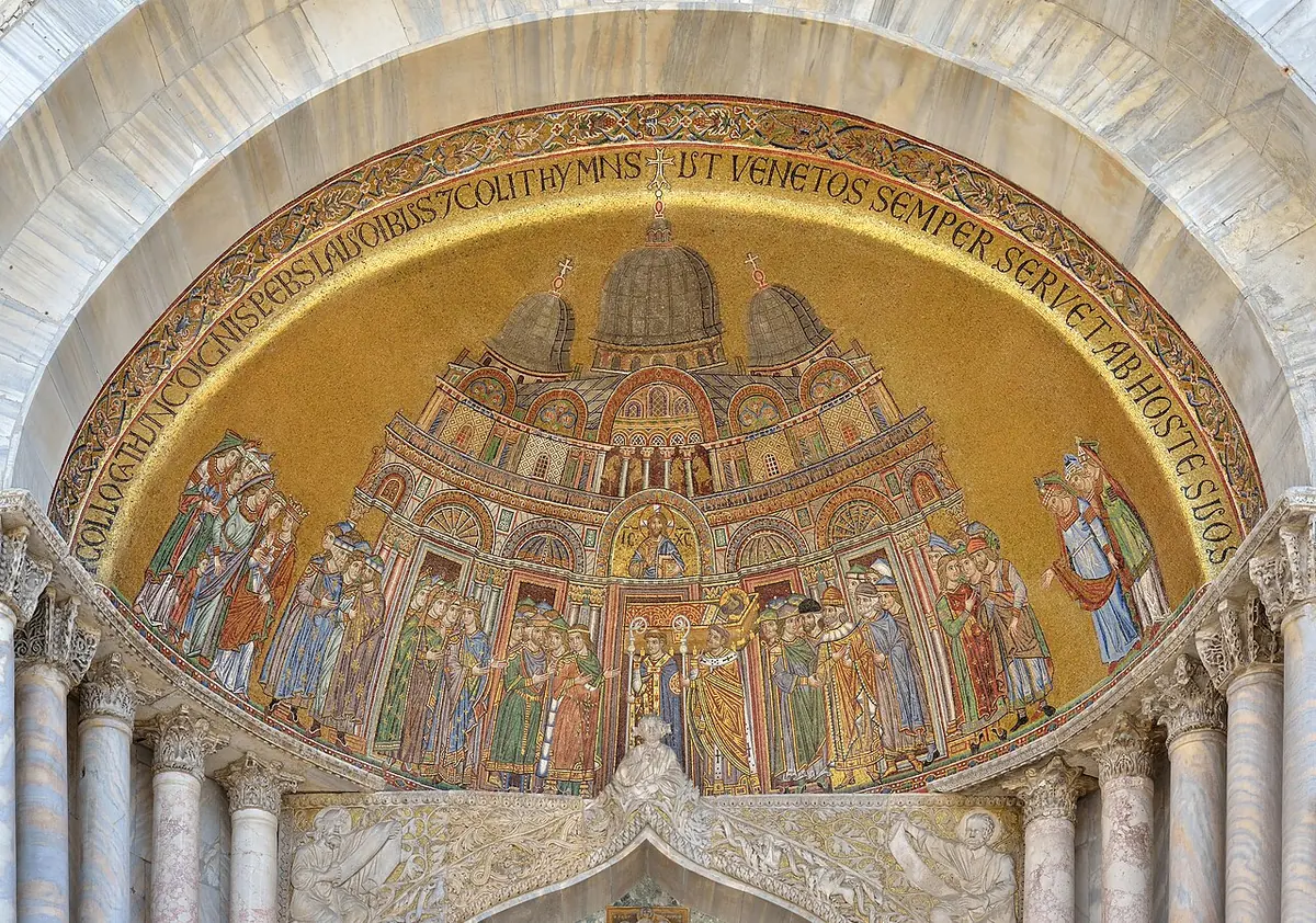 Medieval gold-ground mosaic in a lunette showing clergy and the doge carrying St. Mark's coffin into a domed basilica, watched by a crowd of Venetians