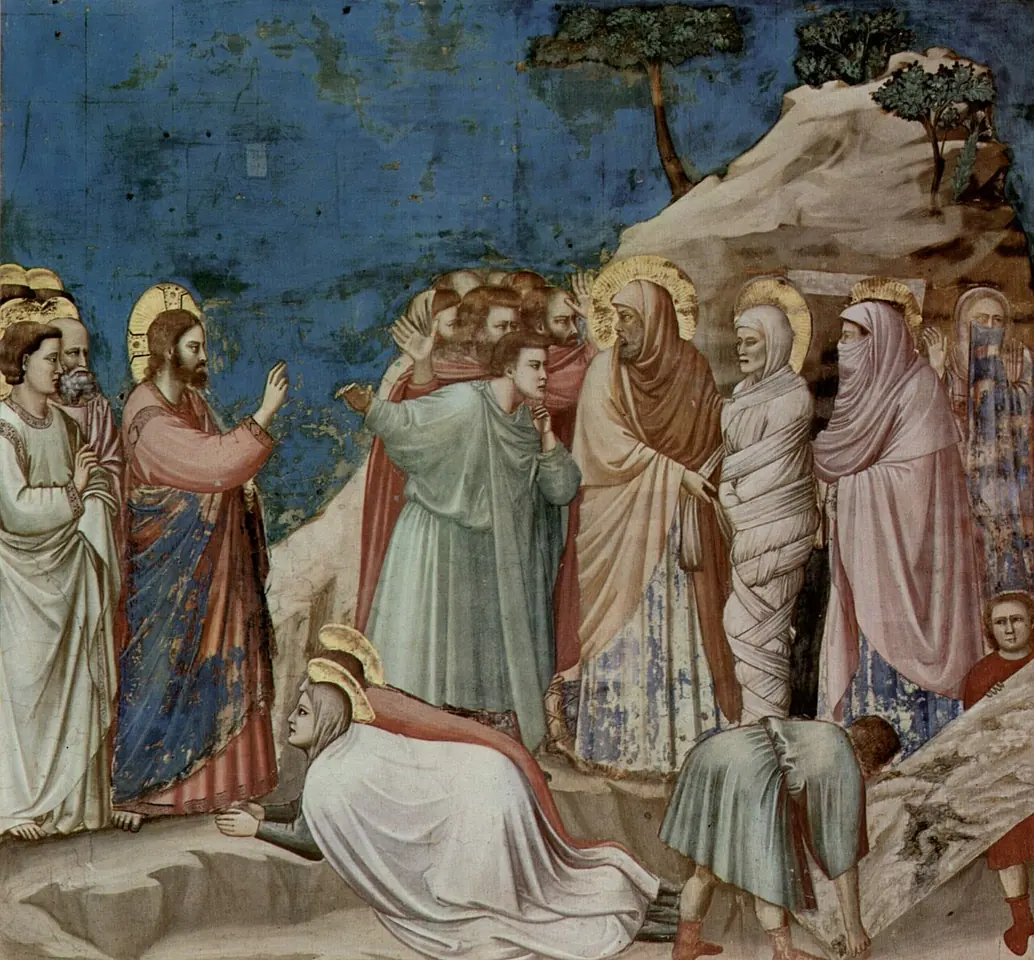 Fresco de Cristo que levanta la mano hacia Lázaro, envuelto en vendas a la puerta de un sepulcro de roca, con las dos hermanas arrodilladas a sus pies y gente que se tapa la nariz
