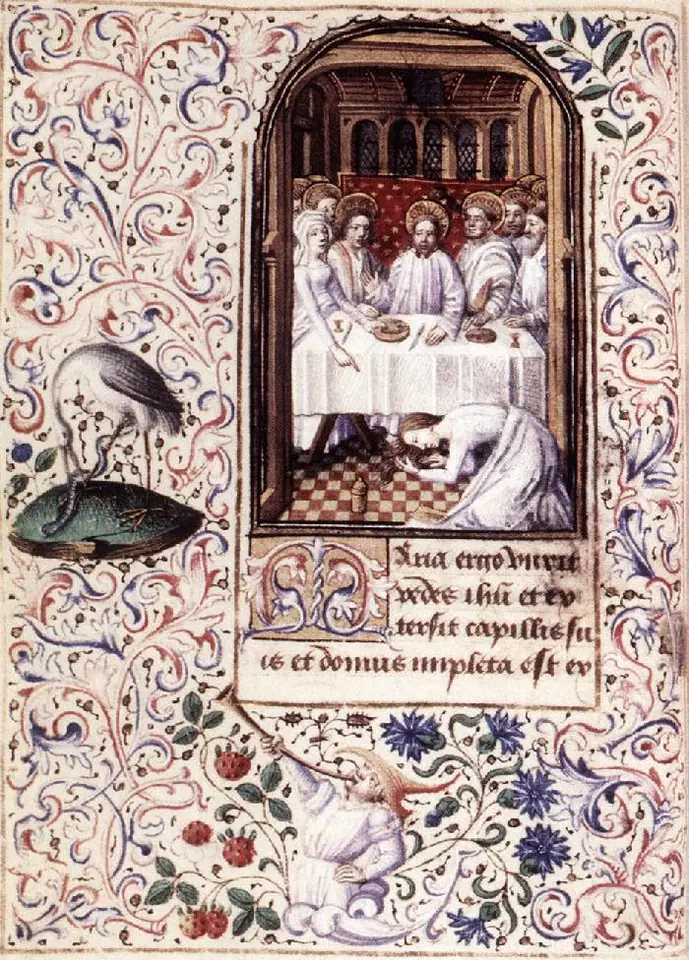 Manuscript page with a painted supper scene of Jesus and his disciples at a white-covered table while a woman kneels on the checkered floor at his feet, framed by a border of flowers, leaves and a heron
