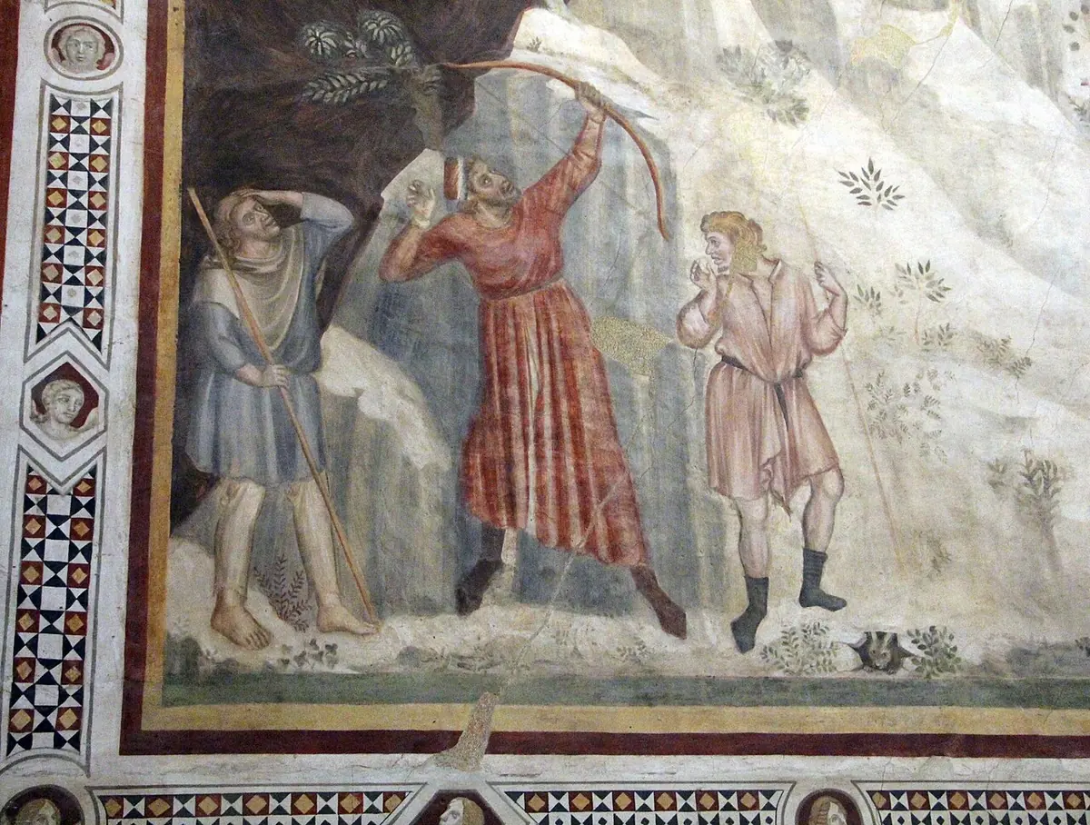 Fresco medieval de tres pastores en una ladera rocosa; el de rojo retrocede herido por su propia flecha, mientras la cabeza de un toro asoma desde una cueva