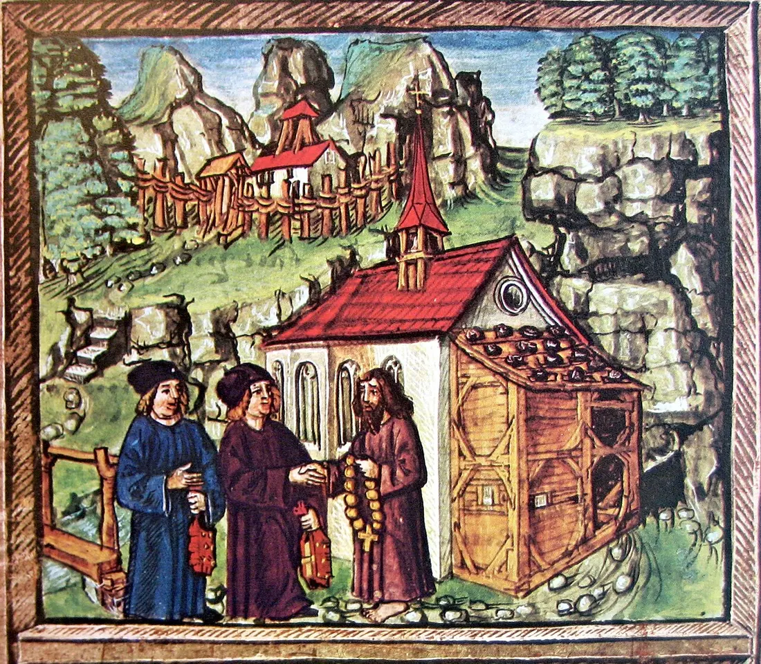 Manuscript painting of a bearded hermit in a brown habit outside a small red-roofed chapel in a rocky ravine, speaking with two men in blue and red robes