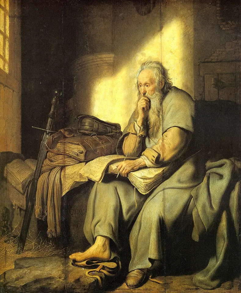 Rembrandt painting of an old, white-bearded Paul sitting on a straw bed in a prison cell, his hand at his chin, papers in his lap and a sword leaning beside him, lit by a beam of sunlight through a barred window