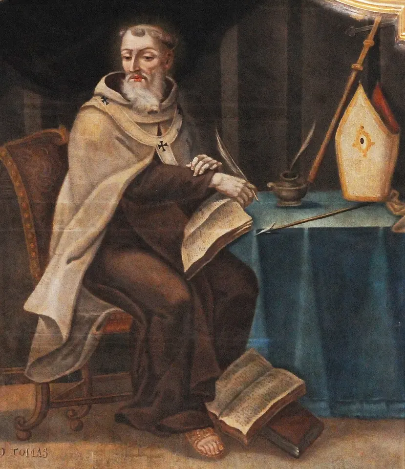 Painting of a gray-bearded friar in a brown habit and cream mantle seated at a table, writing in a book with a quill, with a miter and crozier beside him