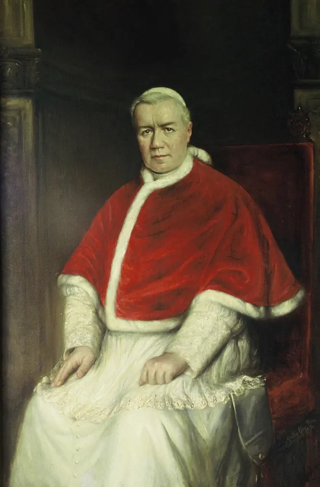 Oil portrait of Pope Pius X seated, an older man with white hair in a red fur-trimmed mozzetta over a white cassock, looking calmly at the viewer