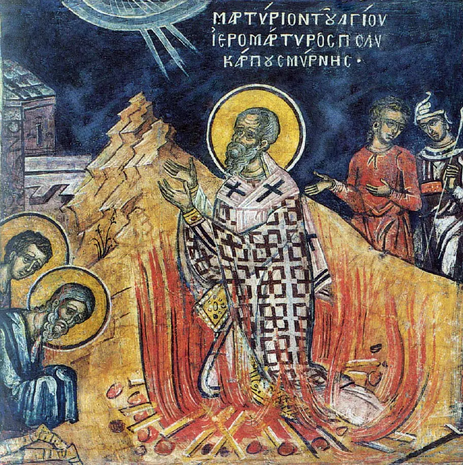 Greek fresco of the white-bearded Polycarp in a bishop's checkered vestments, hands raised in prayer as flames rise around him on a heaped pyre, with onlookers on each side