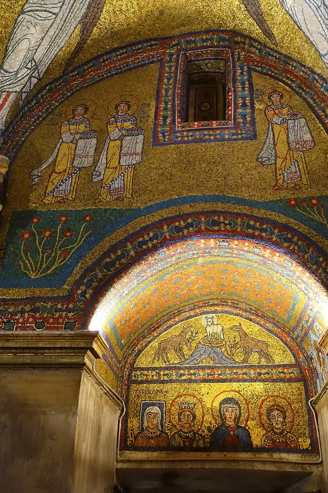 Gold mosaic vaults of a small chapel, with standing saints above and, in a lower lunette, the Virgin Mary between female saints