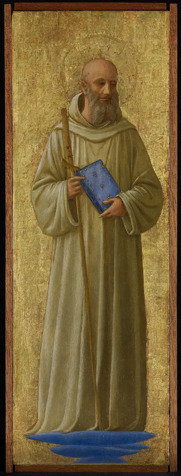 Tall narrow panel of a bearded monk in a pale habit standing on a gold ground, holding a crutch-shaped staff and a blue book