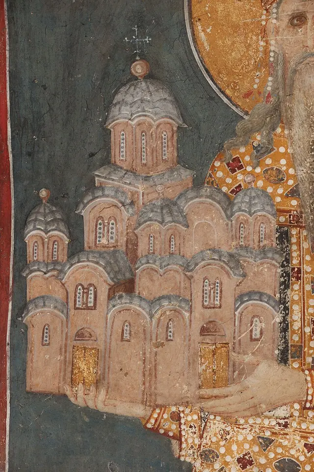 Detail of a medieval fresco of a hand holding a model of a tall five-domed church with arched windows