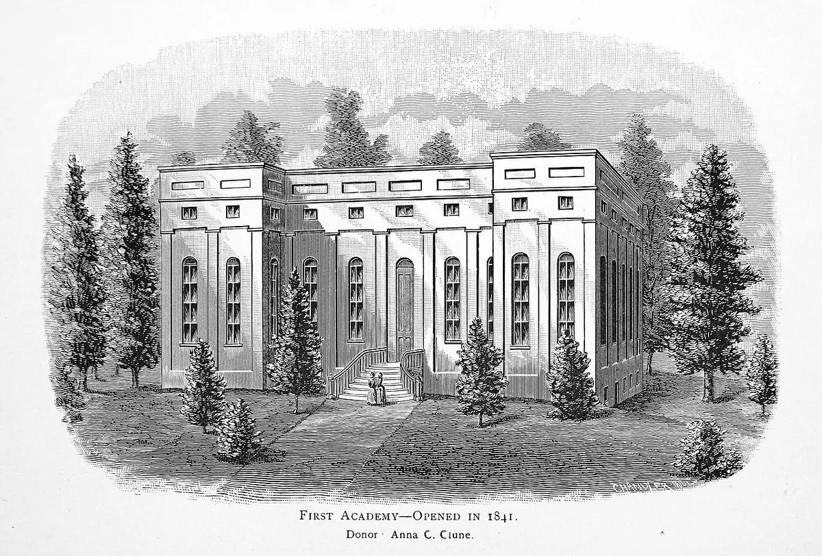 Engraving of a long two-story brick building with tall windows among evergreen trees