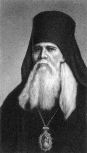 Black-and-white portrait of the elderly Theophan in a black monastic hood with a long white beard and a panagia on a chain