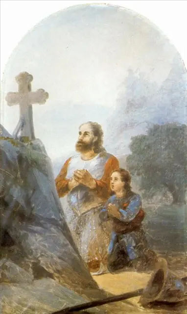 Painting of a bearded commander in armor kneeling in prayer before a stone cross on a rocky hill, with a young soldier kneeling beside him and a pale sky behind