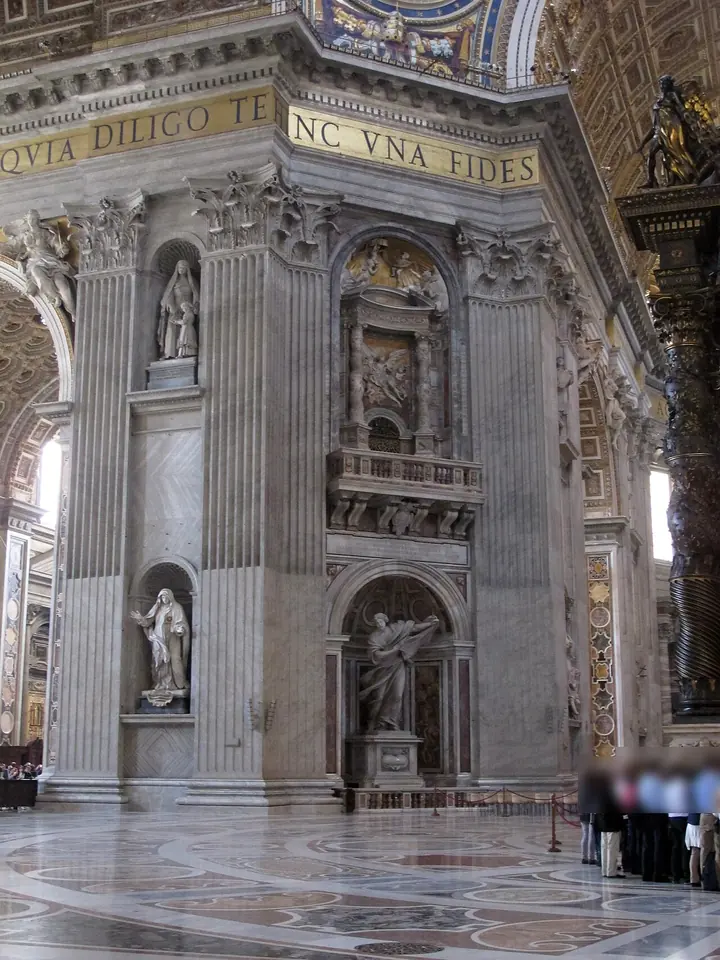 One of the huge piers under the dome of St. Peter's, with Mochi's statue of Veronica in a lower niche and a balcony with a relief panel above it
