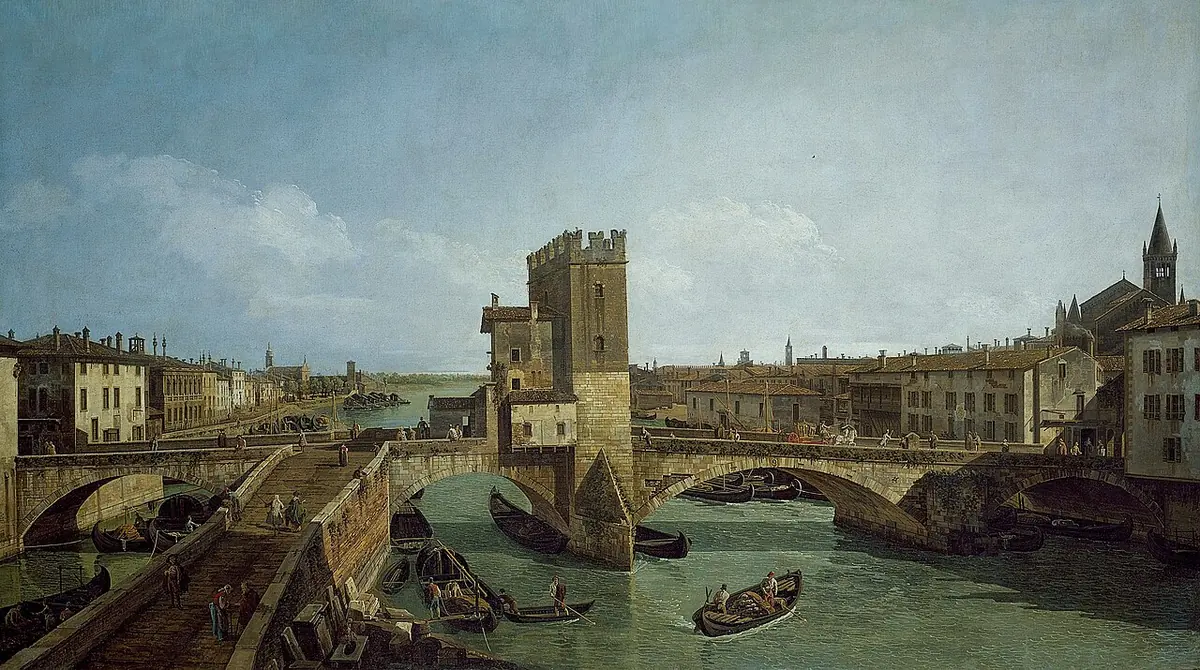 Eighteenth-century painting of the river Adige in Verona, with an old stone bridge and its tower, boats on the water and rows of houses along both banks