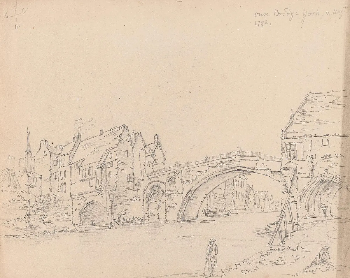 A pale pencil sketch of an old stone bridge with one great arch over a river, with houses crowded along it and a small figure on the bank
