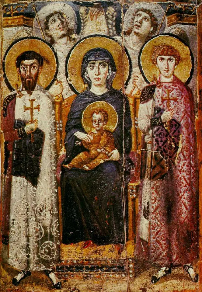 Early Byzantine painted icon of the Virgin enthroned with the Christ Child on her lap, between two soldier saints in rich robes, with two angels behind the throne looking upward